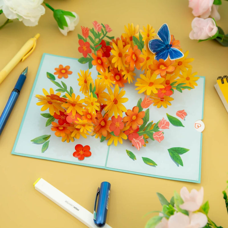 Carte pop-up Marguerites colorées avec papillons